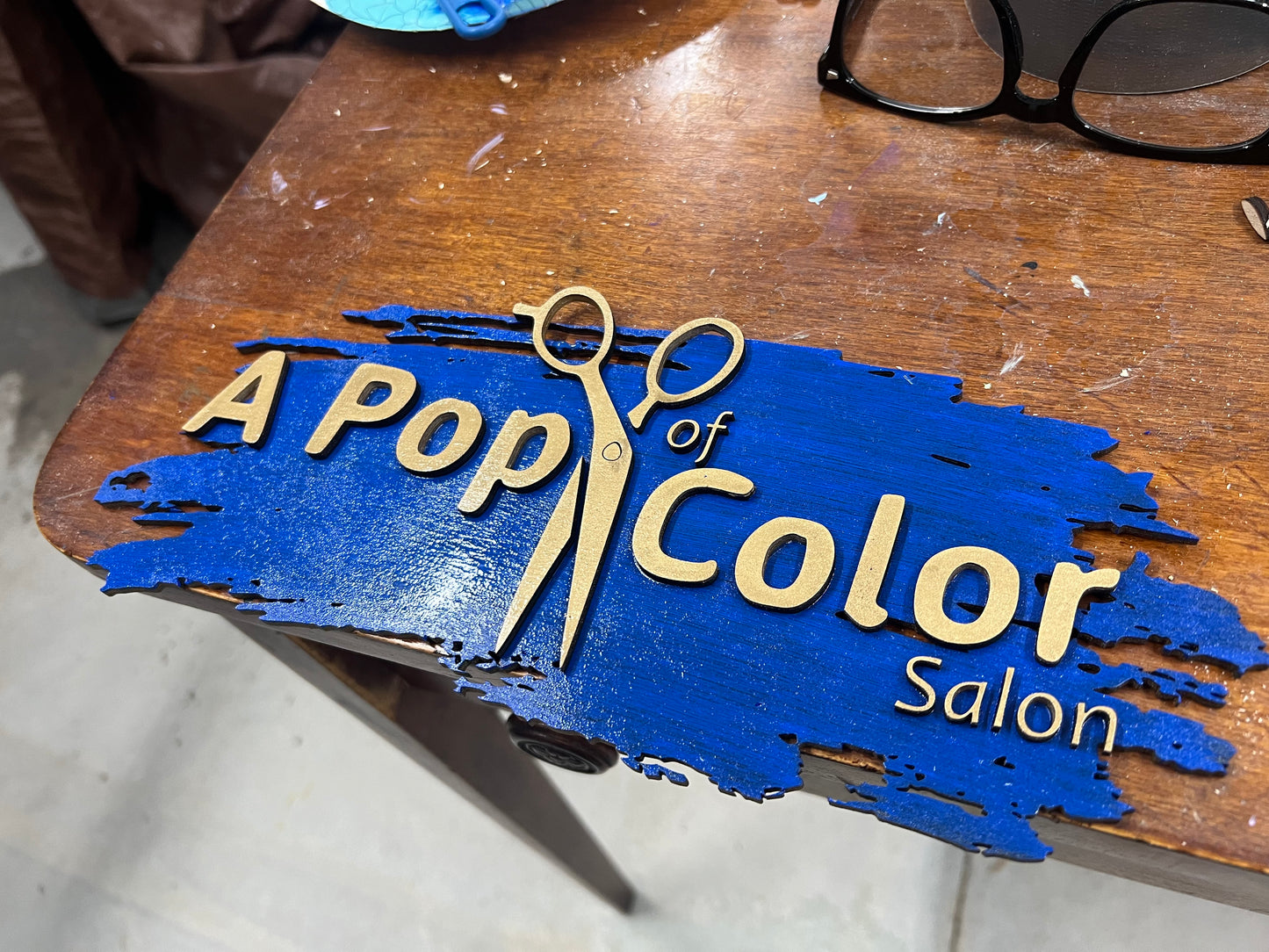 Wooden business sign created from their logo graphic.